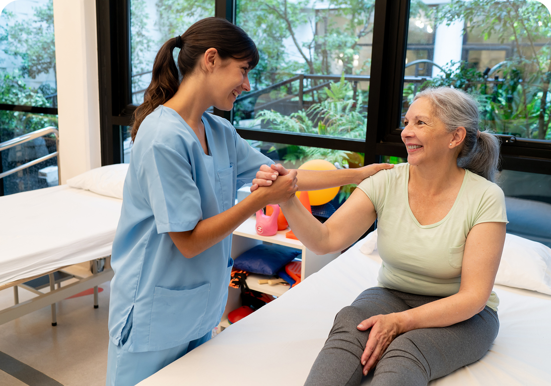 Nurse assisting elderly woman in therapy